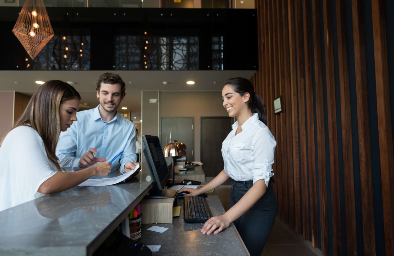 istock-hotel-worker-serving-customers