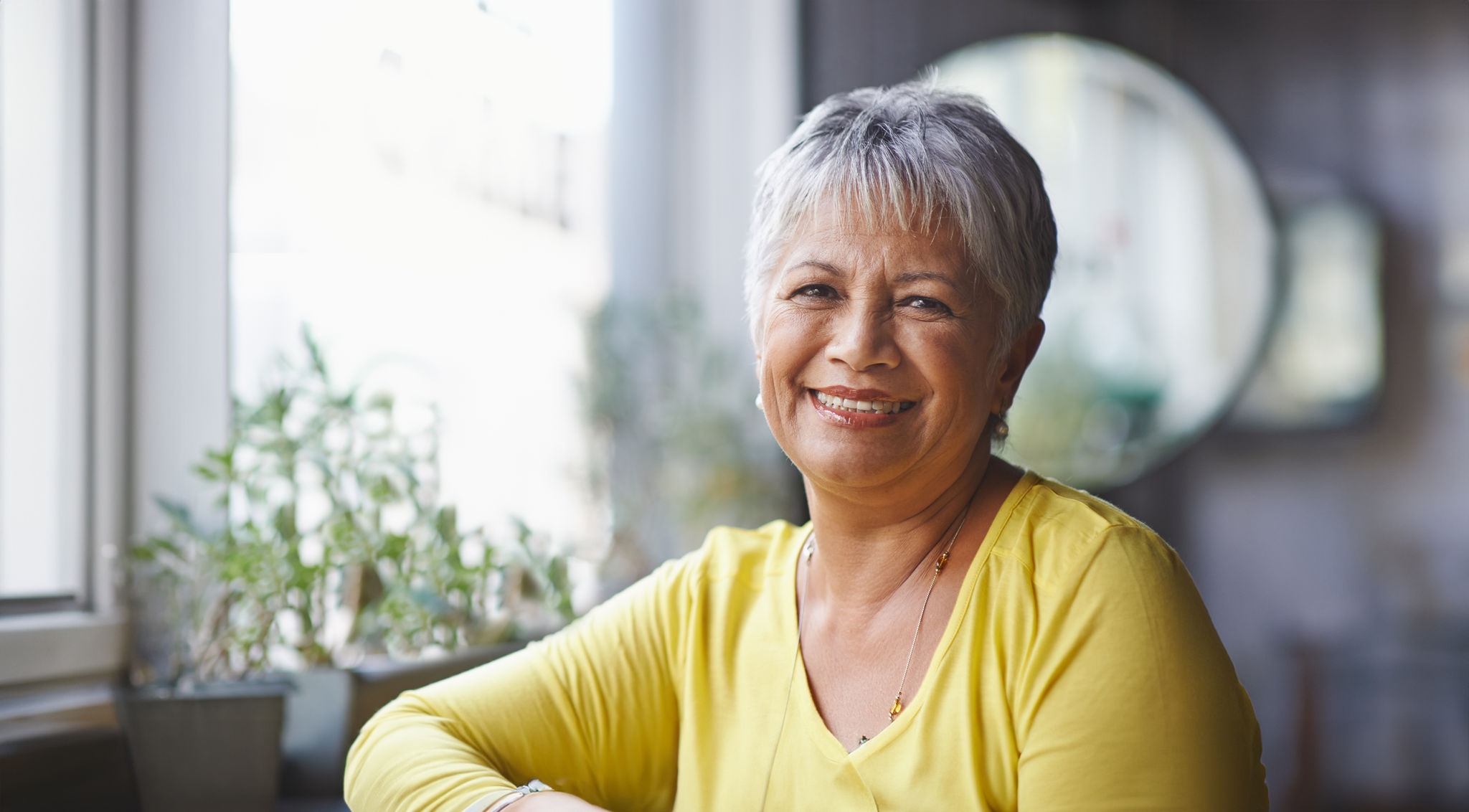 Portrait of a mature woman sitting in a coffee shop.