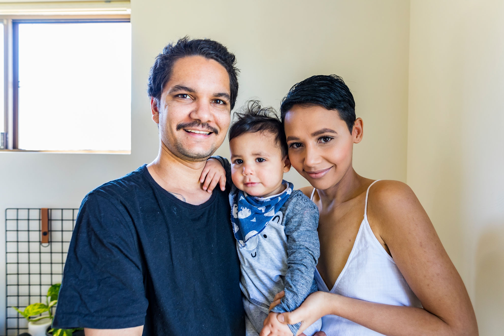 Family of young indigenous Australian's at home