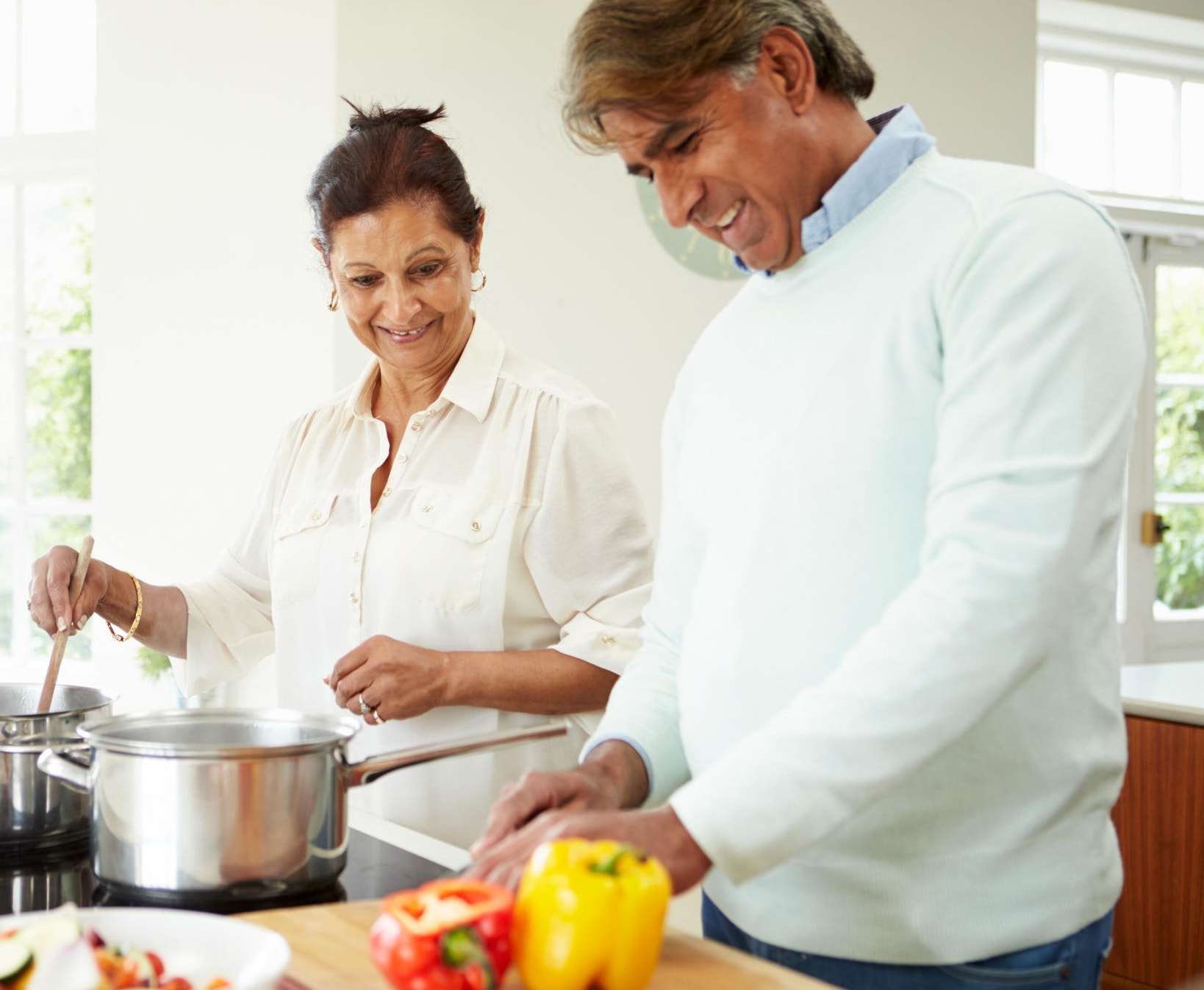 Couple cooking dinner together