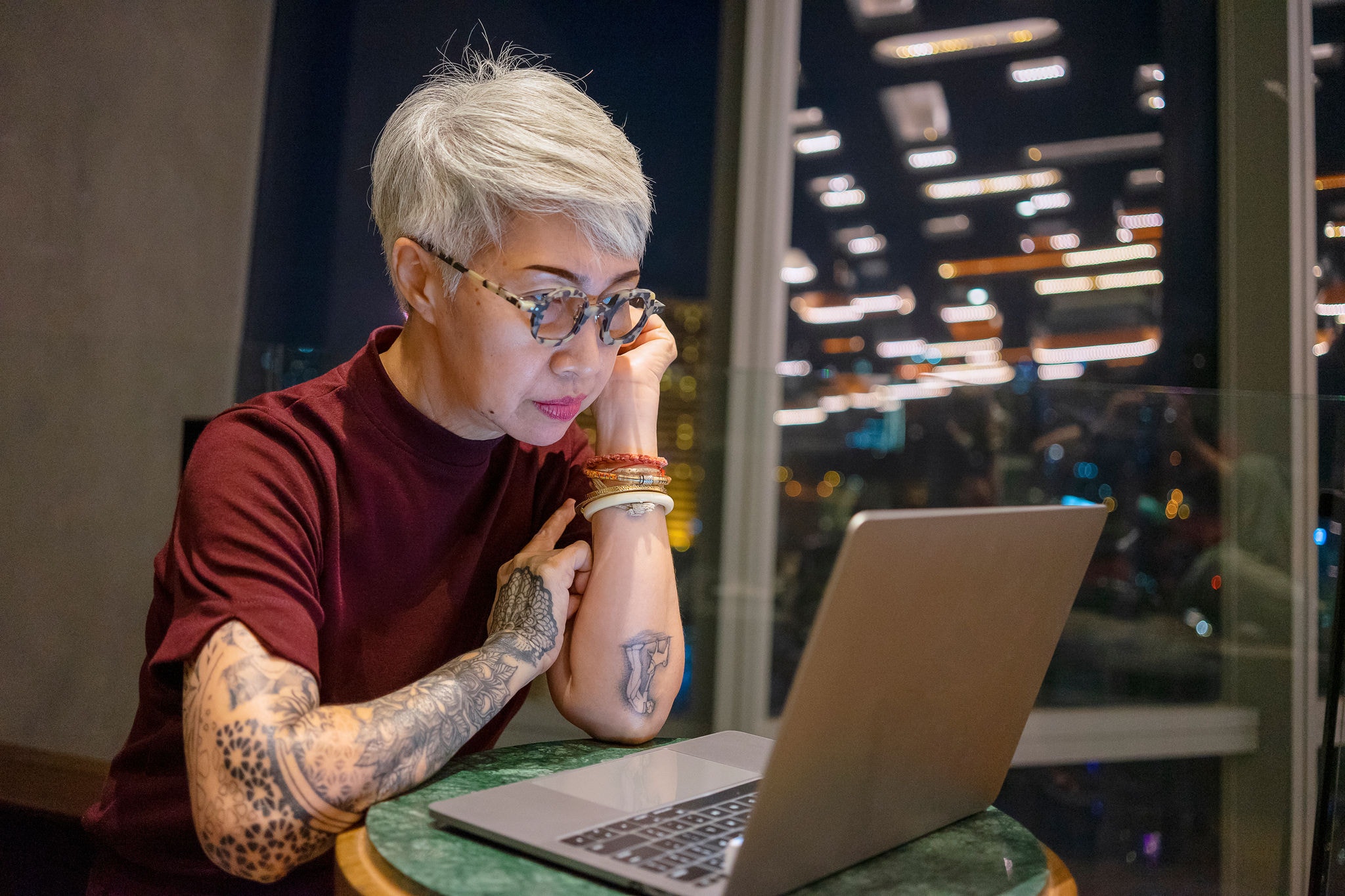 Senior woman with technology. Daily life at night. Solo daily life.