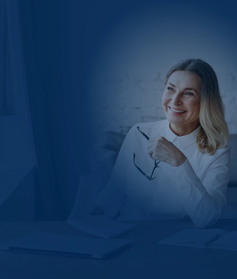 Woman holding glasses and smiling - desktop