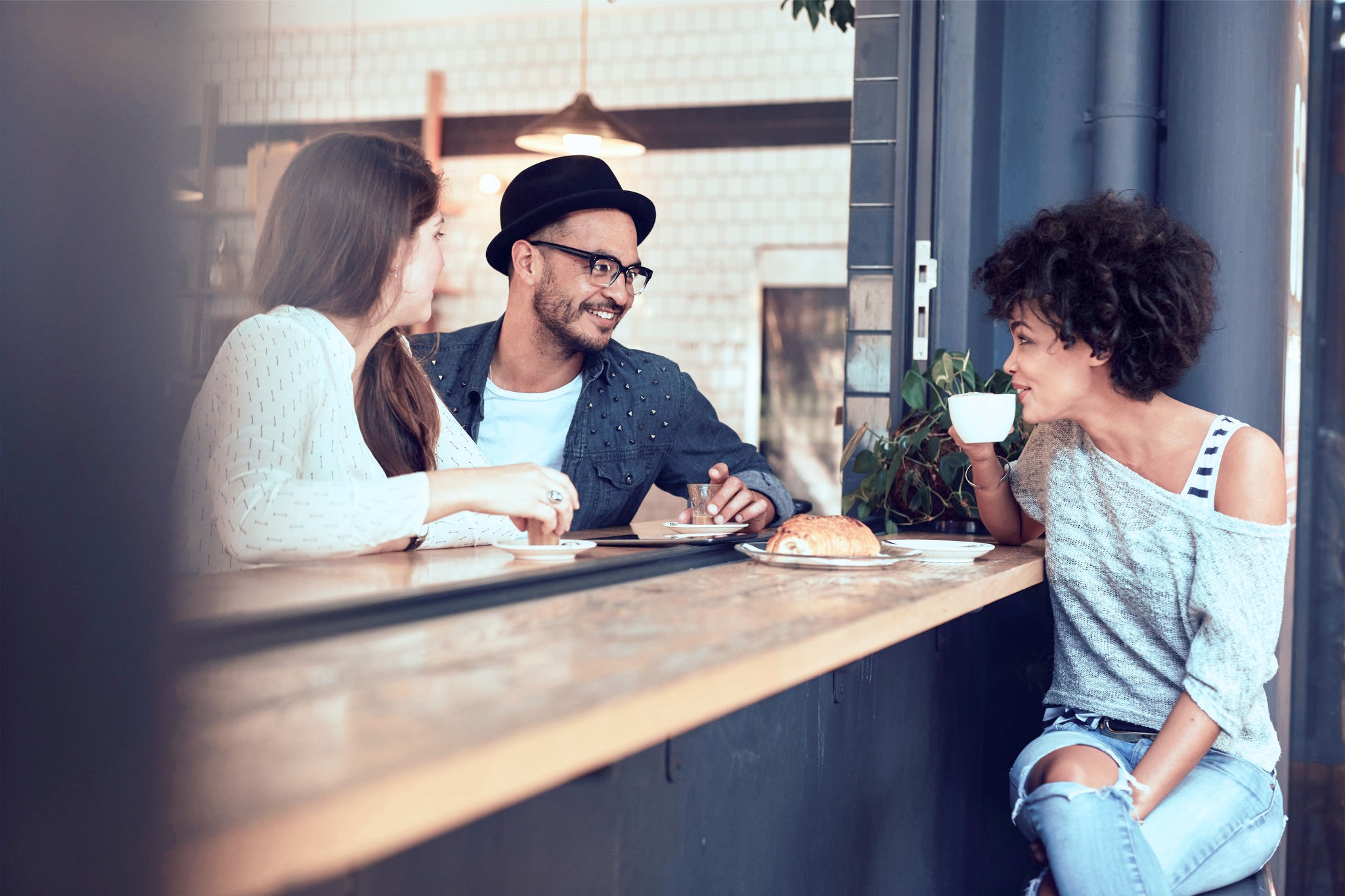 canva-people-sitting-in-cafe