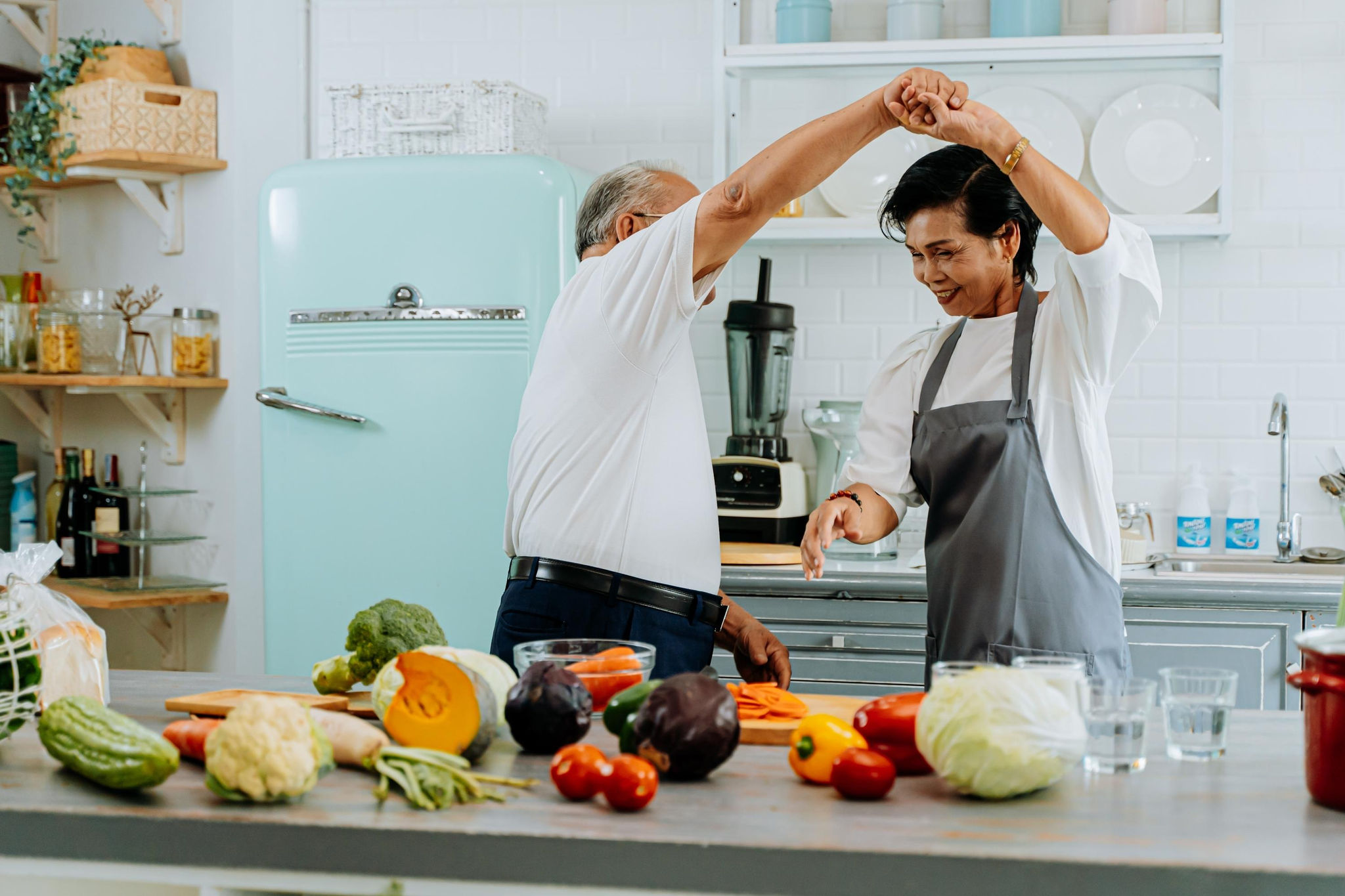 Couple cooking and dancing in the kitchen