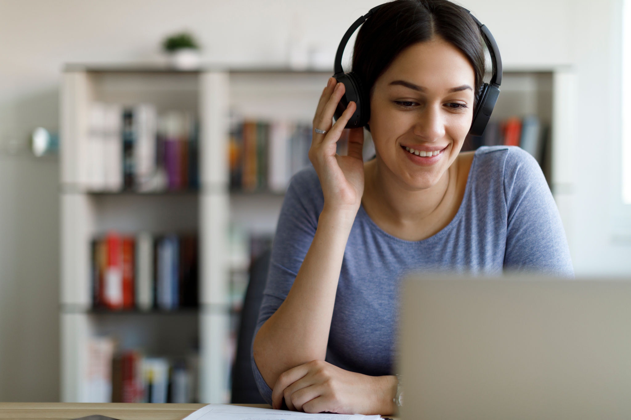 Young smiling woman having video call