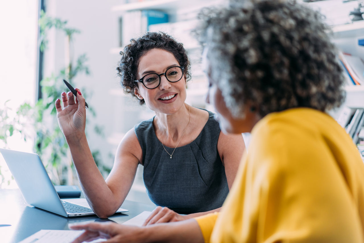 Close up of a financial advisor working with a young couple